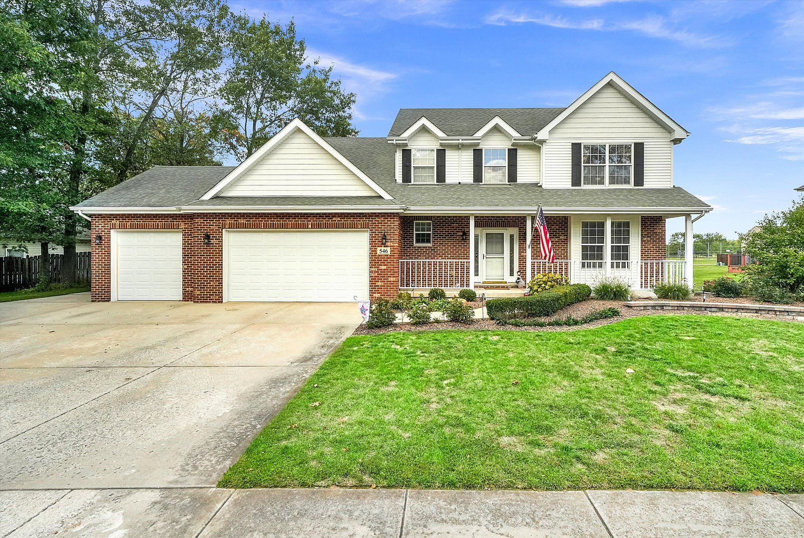 a front view of a house with yard