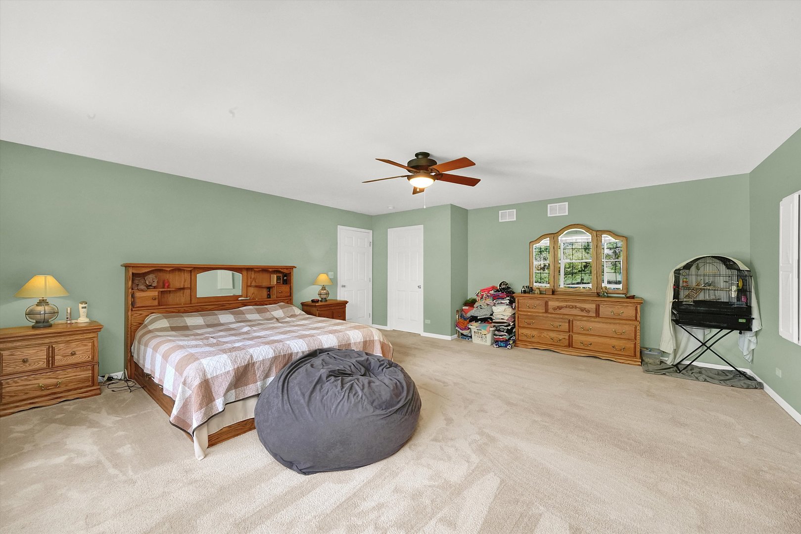 546 Caleb Road Braidwood, IL 60408 - Photo 15 of 34 a bed room with a bed and a chandelier