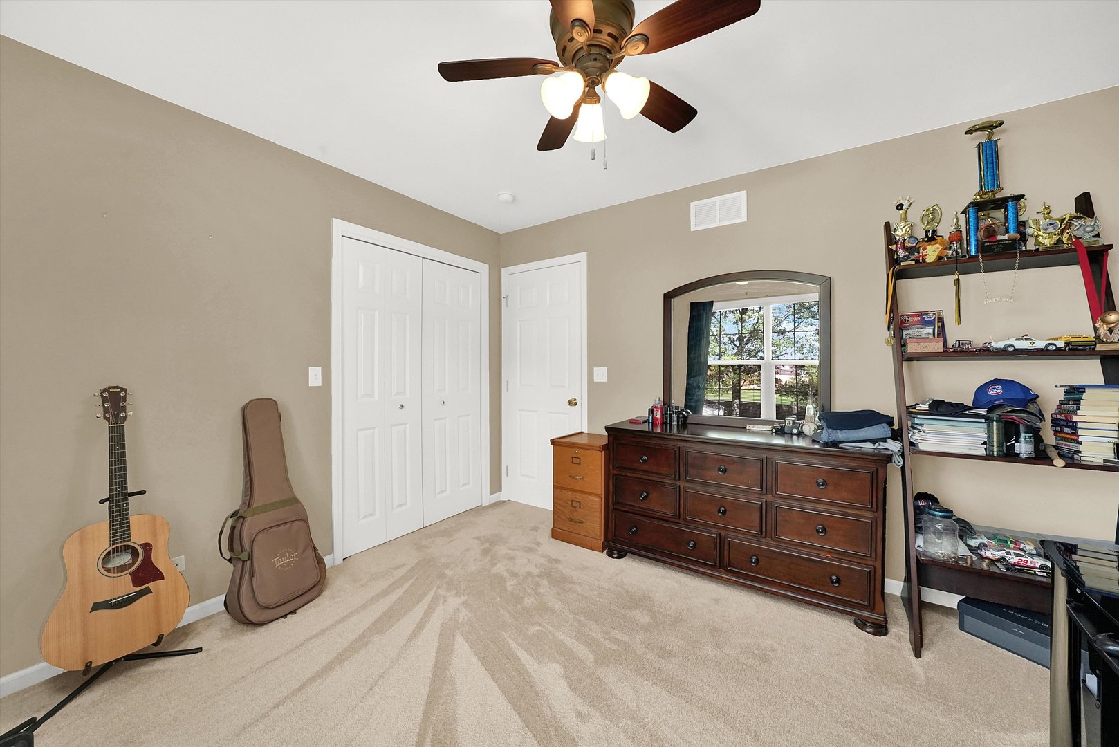 546 Caleb Road Braidwood, IL 60408 - Photo 20 of 34 a bed room with a bed and a dresser