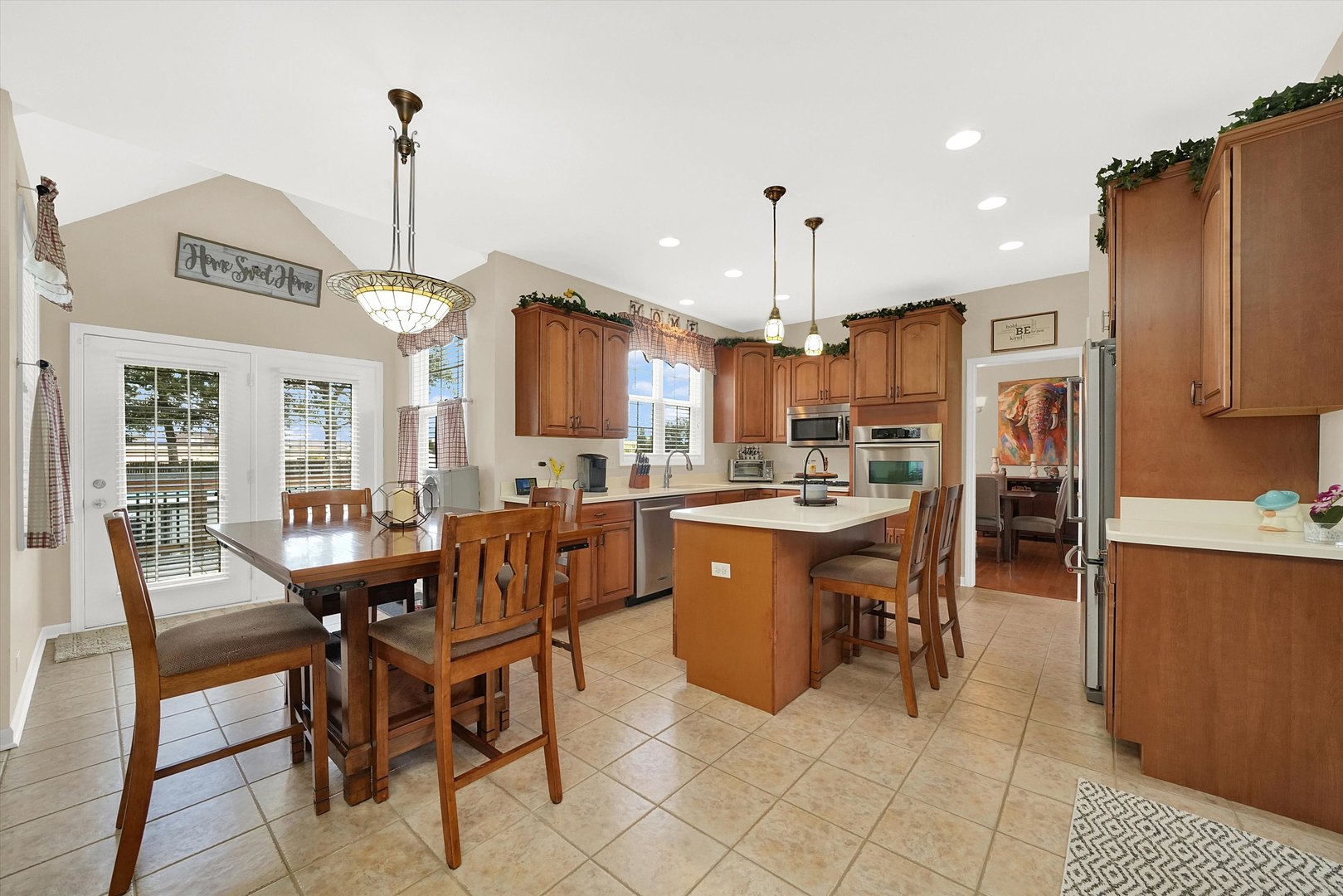 546 Caleb Road Braidwood, IL 60408 - Photo 8 of 34 a view of a dining room and livingroom with furniture wooden floor a chandelier