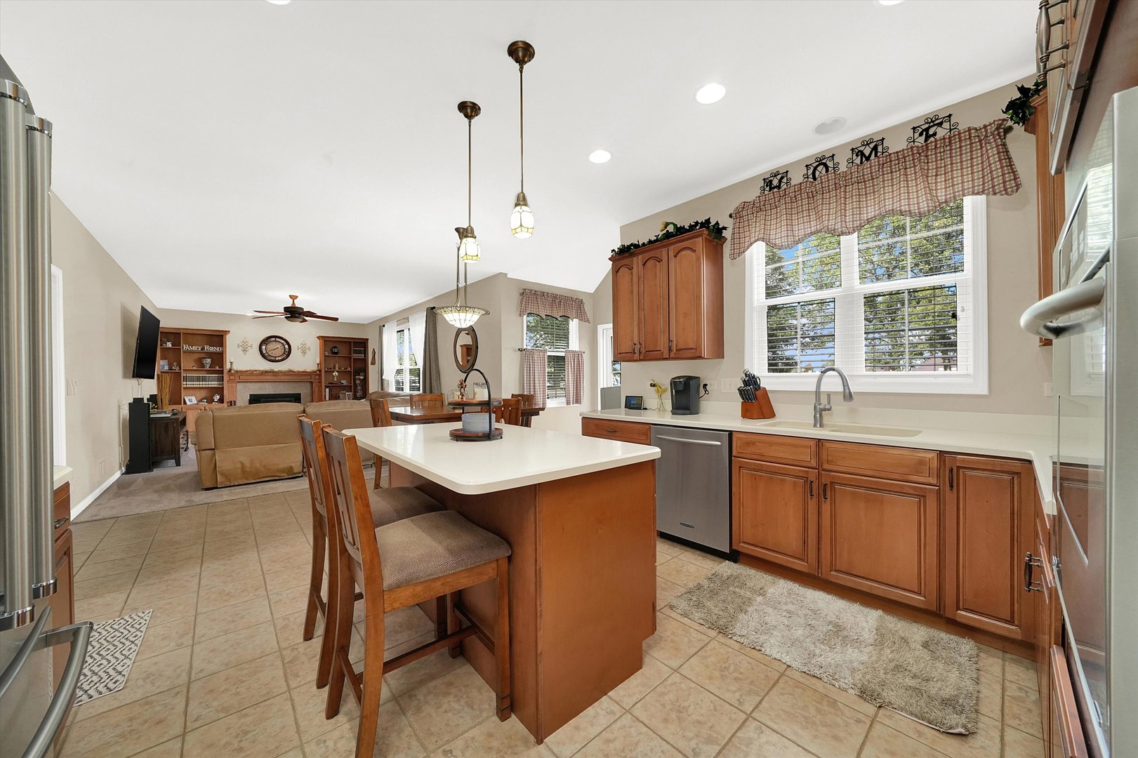 546 Caleb Road Braidwood, IL 60408 - Photo 9 of 34 a large kitchen with kitchen island a sink a stove and a center island