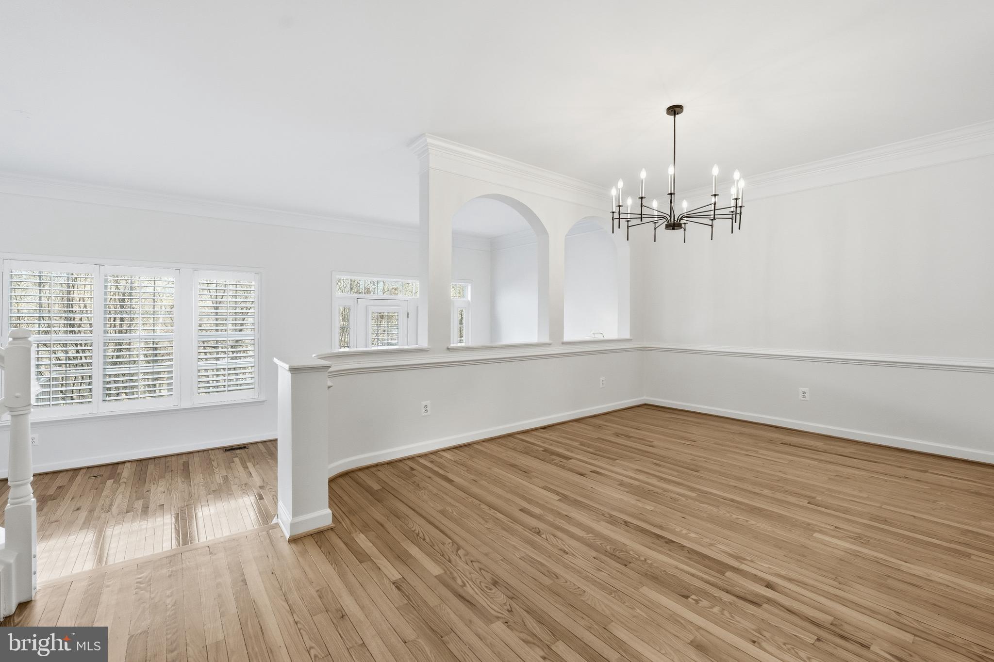 1919 Logan Manor Drive Reston, VA 20190 - Photo 12 of 54 a view of empty room with wooden floor and fan