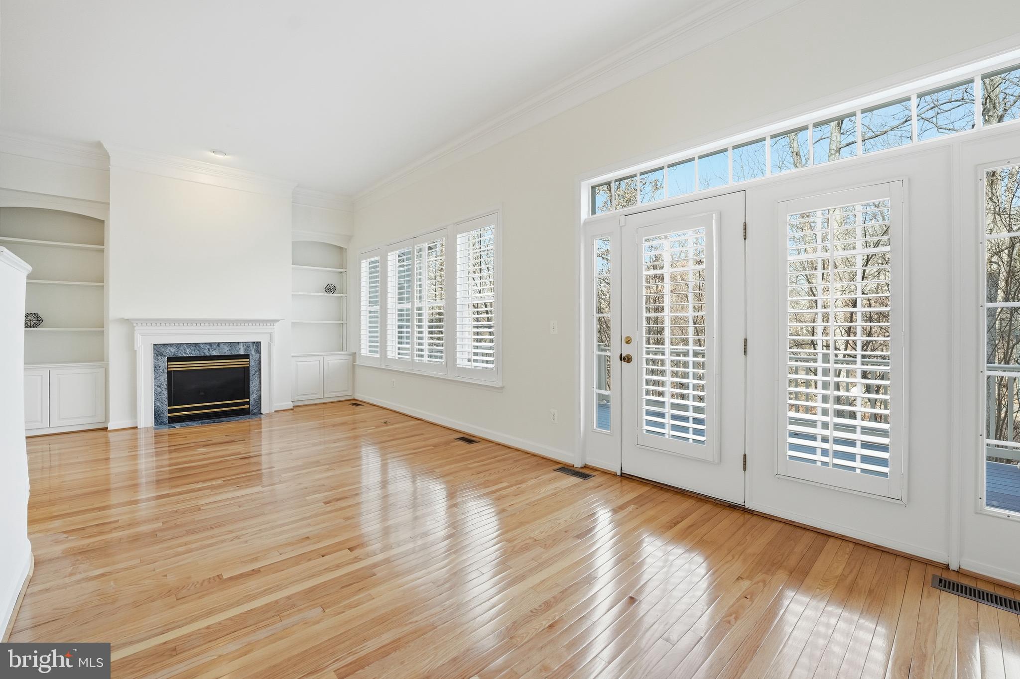 1919 Logan Manor Drive Reston, VA 20190 - Photo 15 of 54 a view of an empty room with wooden floor and a window