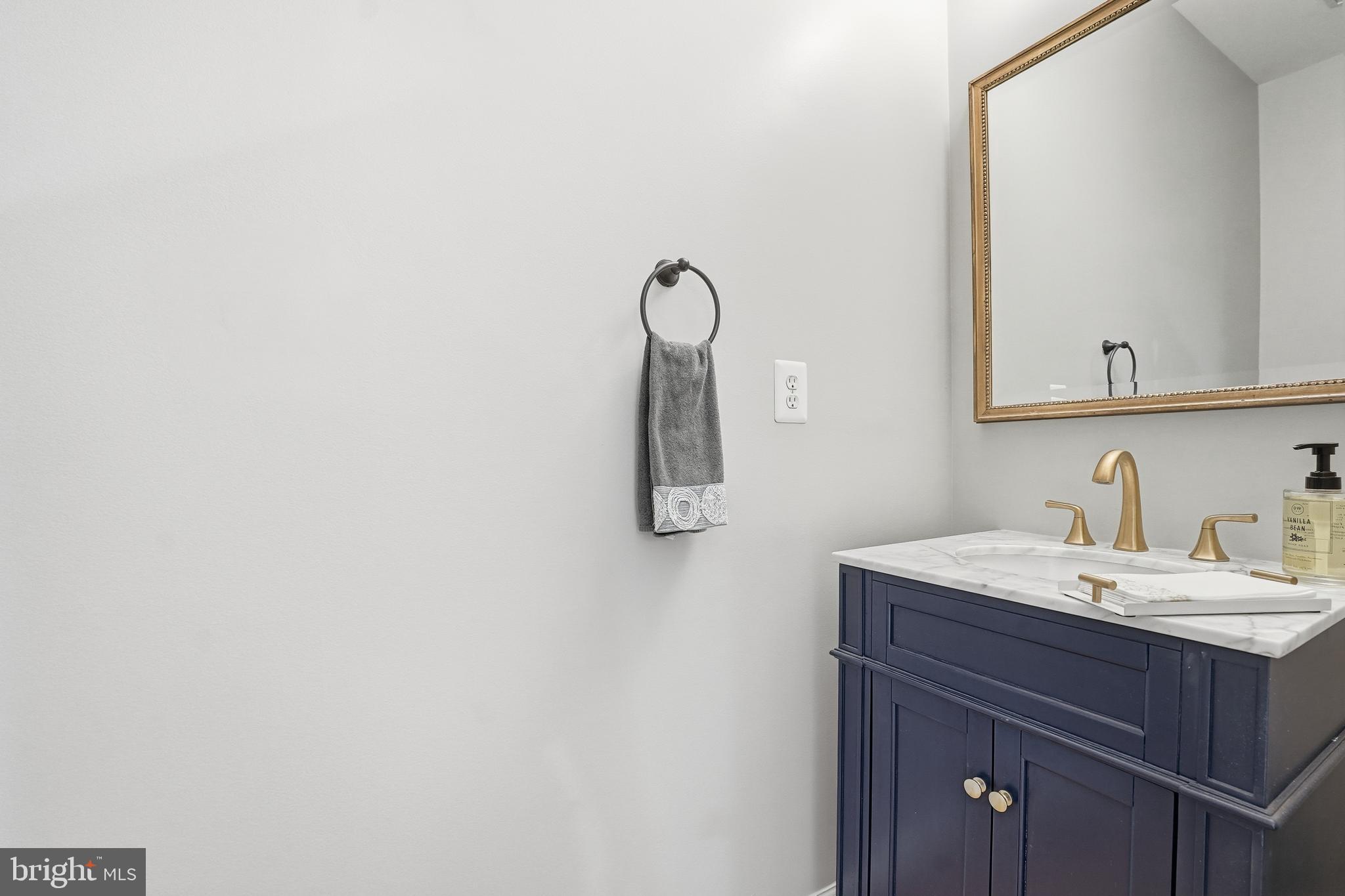 1919 Logan Manor Drive Reston, VA 20190 - Photo 19 of 54 a bathroom with a sink and mirror