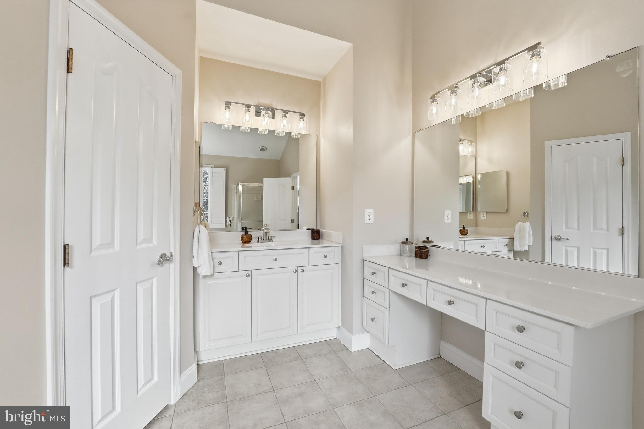 1919 Logan Manor Drive Reston, VA 20190 - Photo 26 of 54 a spacious bathroom with a granite countertop sink mirror and a
