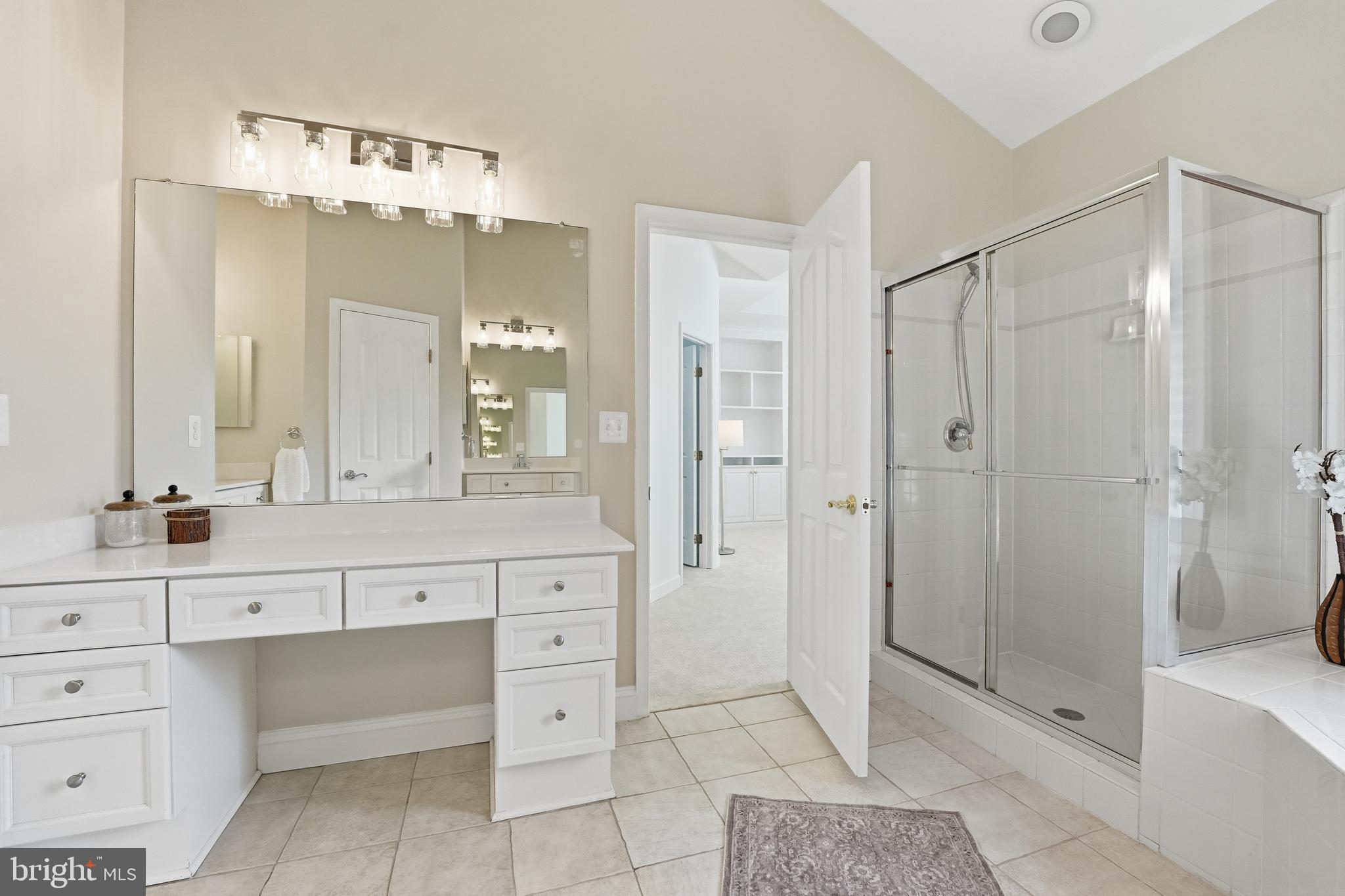 1919 Logan Manor Drive Reston, VA 20190 - Photo 28 of 54 a bathroom with a shower sink and mirror