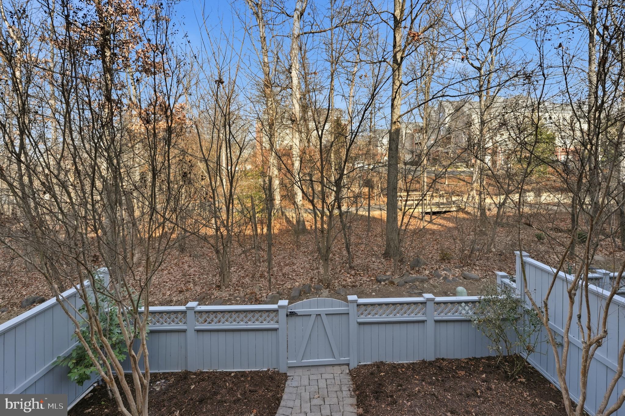 1919 Logan Manor Drive Reston, VA 20190 - Photo 44 of 54 a view of a backyard with iron fence