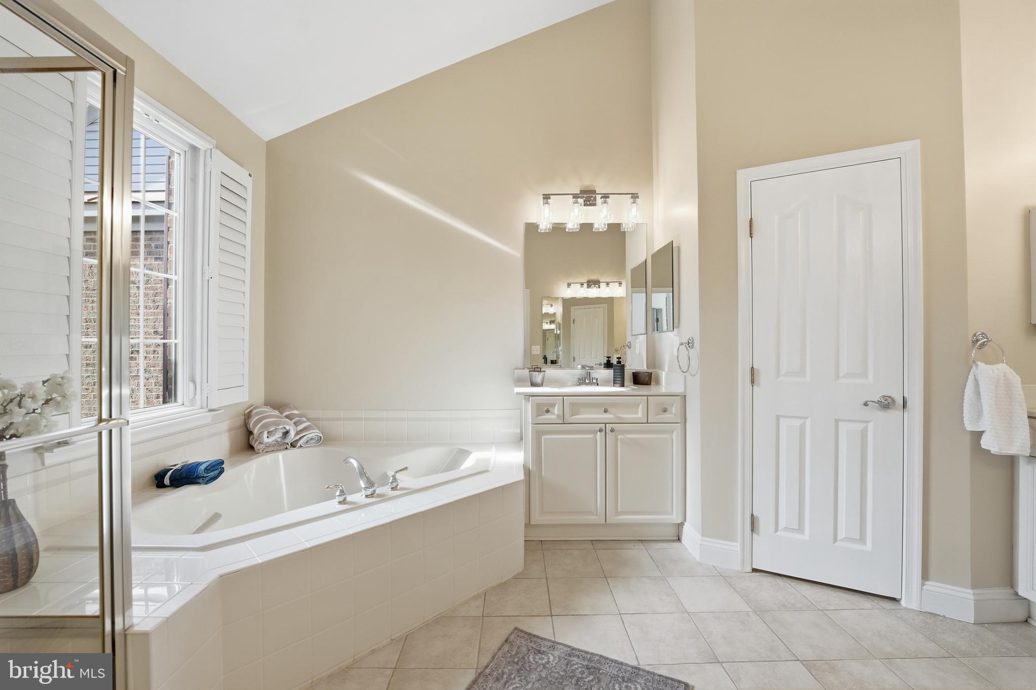 1919 Logan Manor Drive Reston, VA 20190 - Photo 5 of 54 a bathroom with a tub sink and mirror