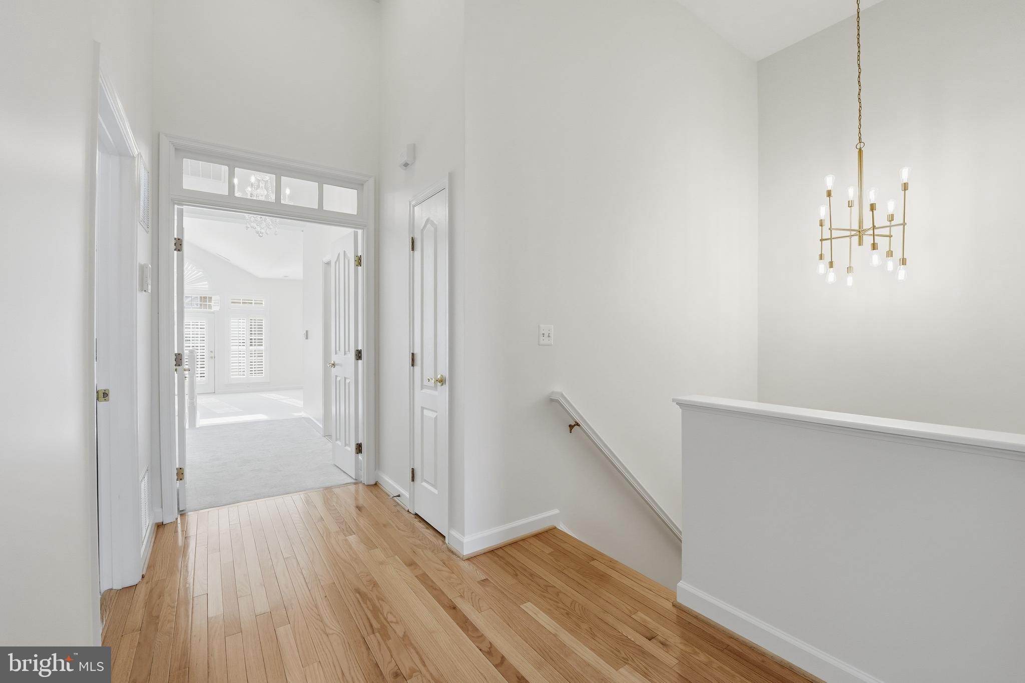 1919 Logan Manor Drive Reston, VA 20190 - Photo 51 of 54 a view of bathroom with a hardwood floor and a hallway