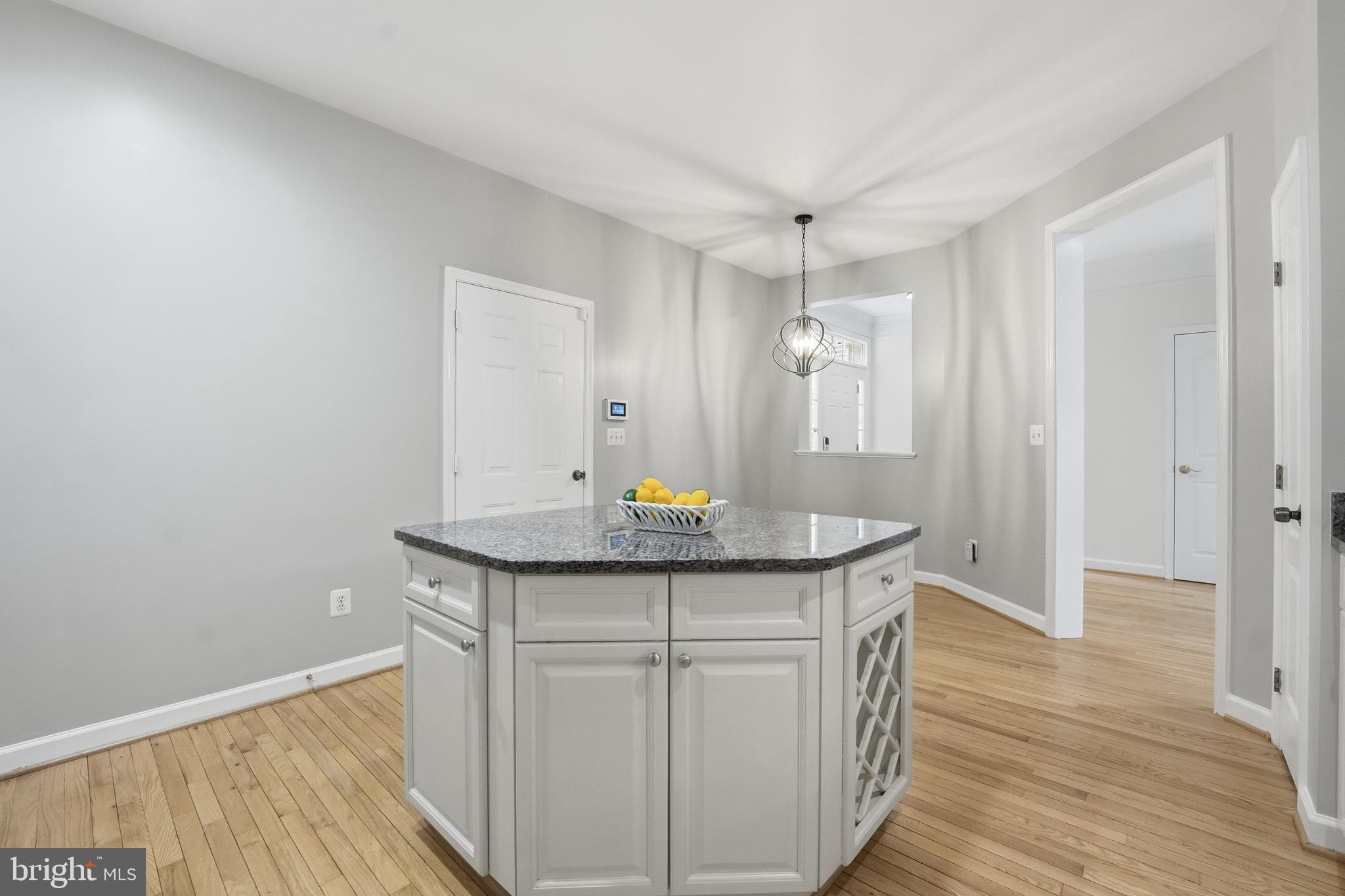 1919 Logan Manor Drive Reston, VA 20190 - Photo 8 of 54 a kitchen with stainless steel appliances granite countertop a sink and wooden floor