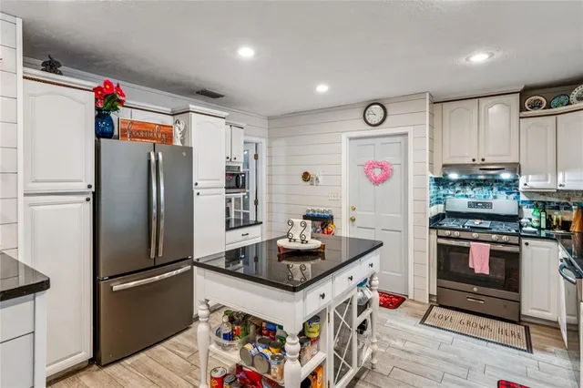 a view of a kitchen and dining area