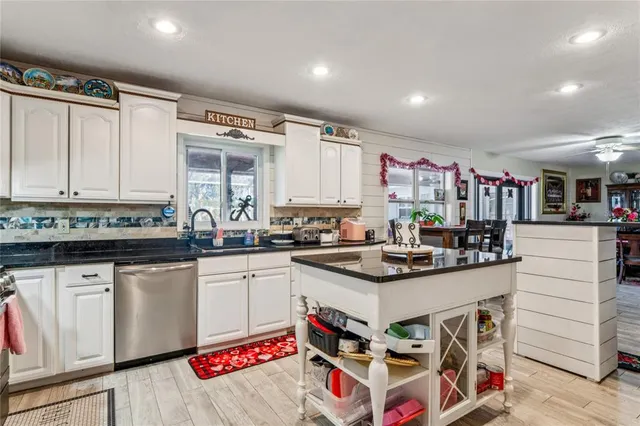 a view of a dining room with furniture and a potted plant