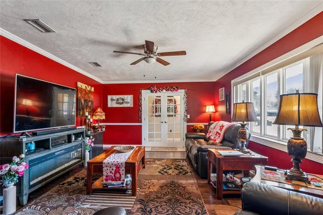 a bathroom with a granite countertop double vanity sink and a mirror