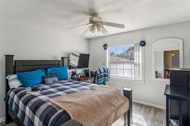 a view of a bedroom with a bed and closet