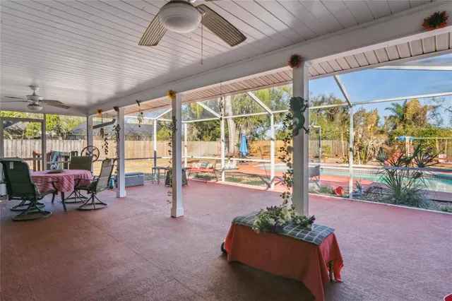 a view of a swimming pool with an outdoor space and seating area
