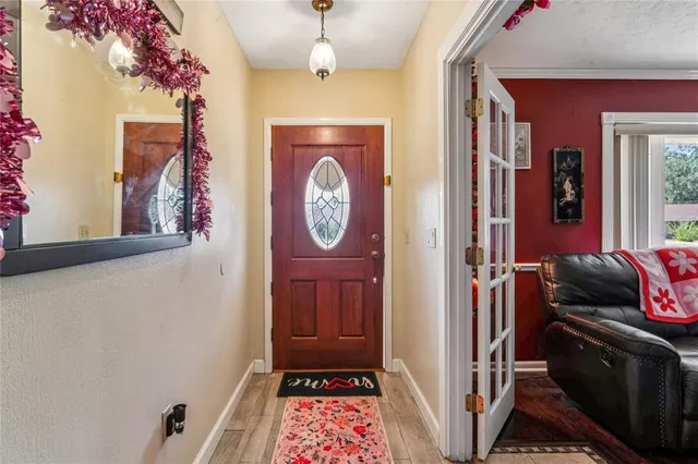 a view of hallway with wooden floor