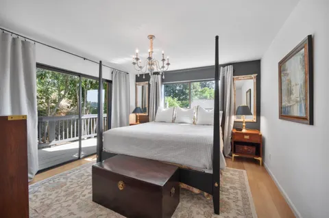 a workspace with furniture bookshelf and a window