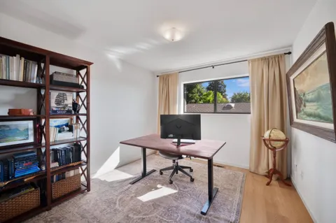 a bathroom with a granite countertop sink toilet a large mirror a vanity and shower