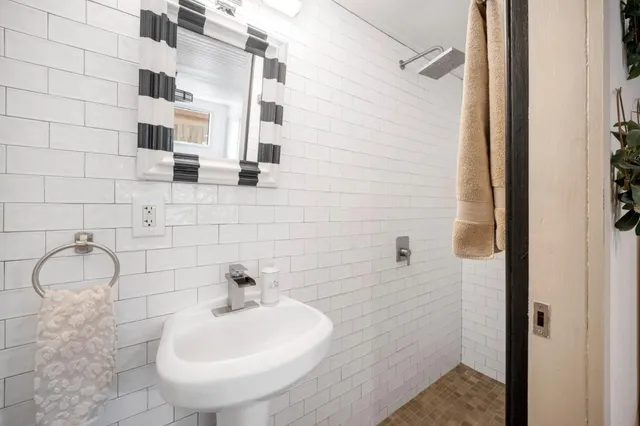 a kitchen with stainless steel appliances granite countertop a stove and a sink