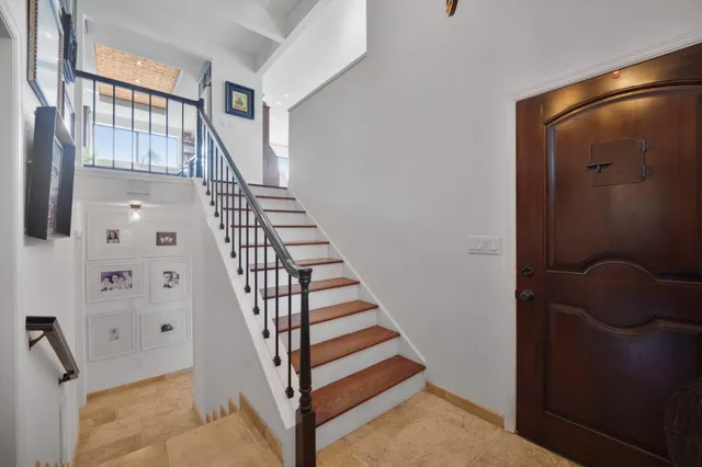 a living room with furniture and kitchen view