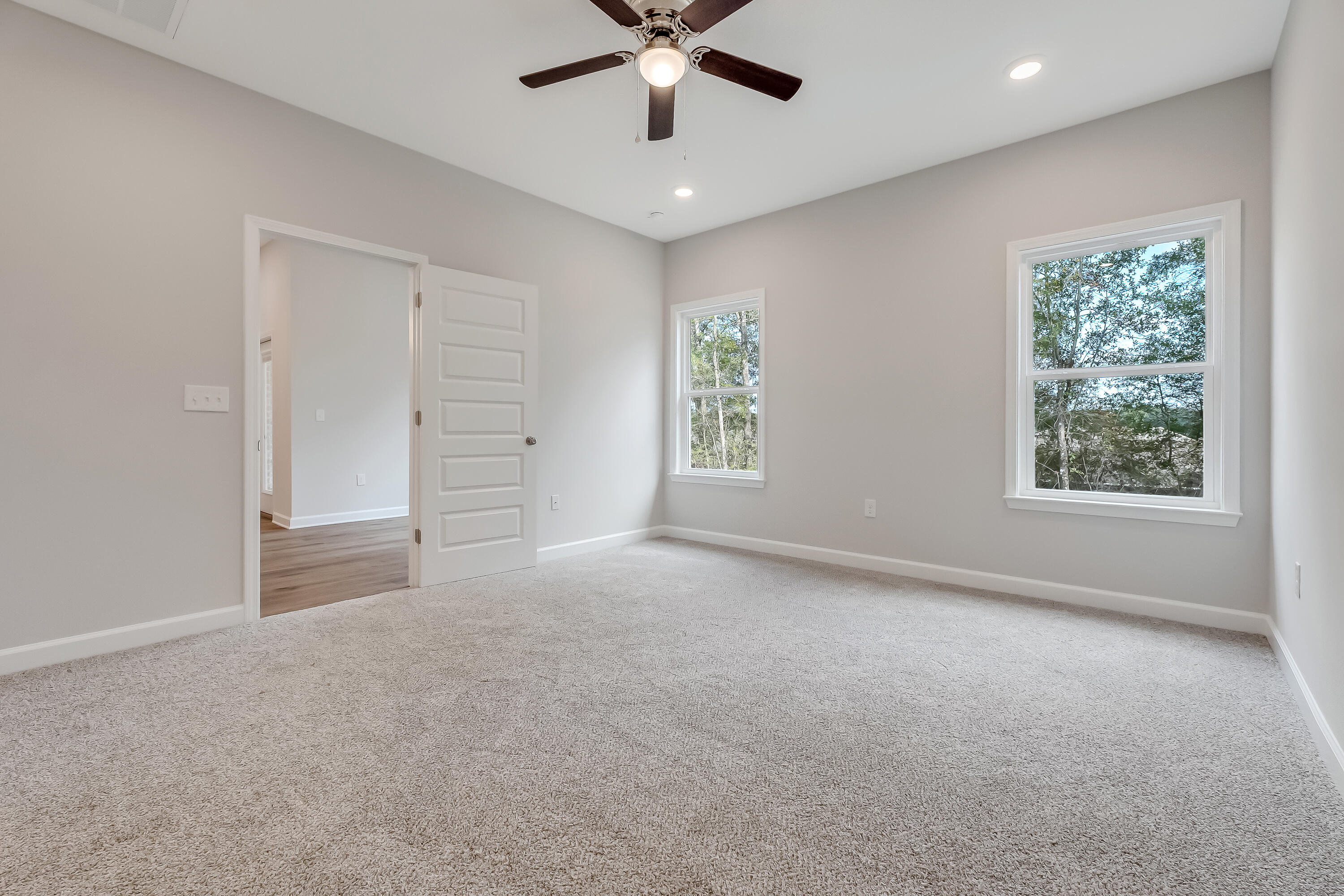 106 Huron Trail Crestview, FL 32536 - Photo 24 of 44 an empty room with windows and ceiling fan