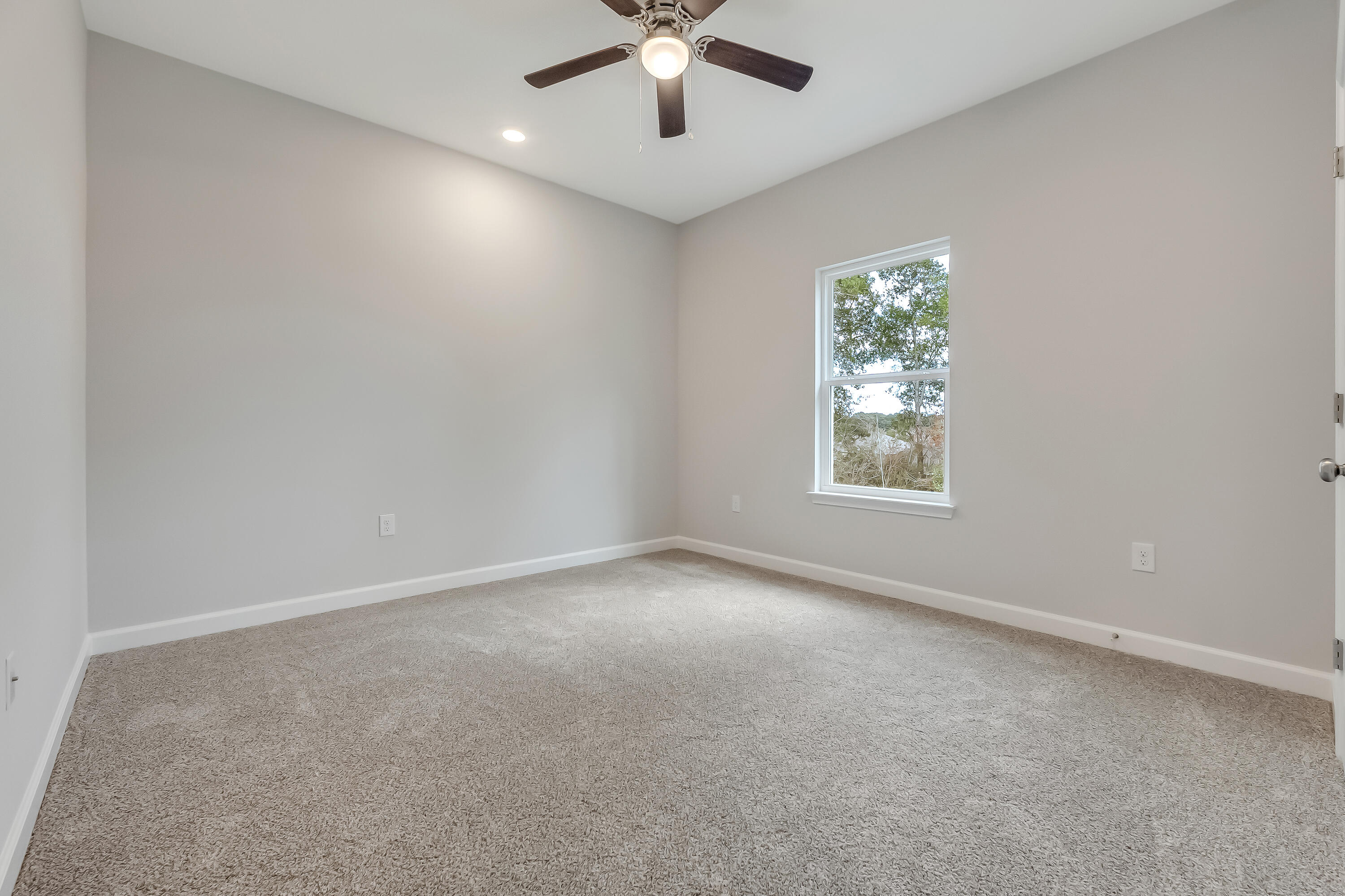 106 Huron Trail Crestview, FL 32536 - Photo 36 of 44 an empty room with windows and ceiling fan