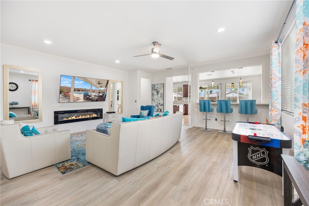 84155 Tramonto Way Indio, CA 92203 - Photo 11 of 38 a living room with furniture and a flat screen tv
