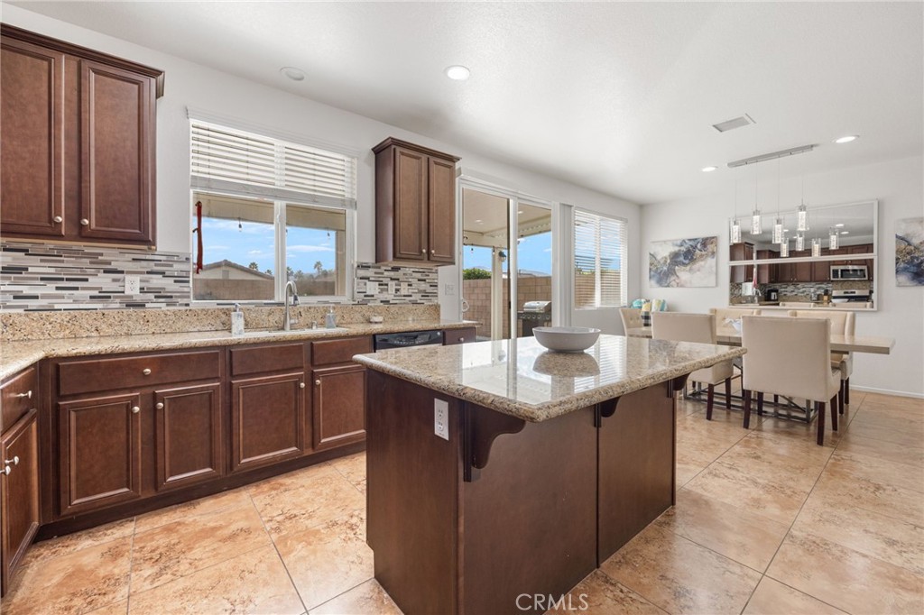 84155 Tramonto Way Indio, CA 92203 - Photo 17 of 38 a kitchen with a sink and cabinets