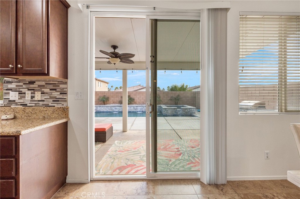 84155 Tramonto Way Indio, CA 92203 - Photo 20 of 38 a view of a kitchen from a hallway