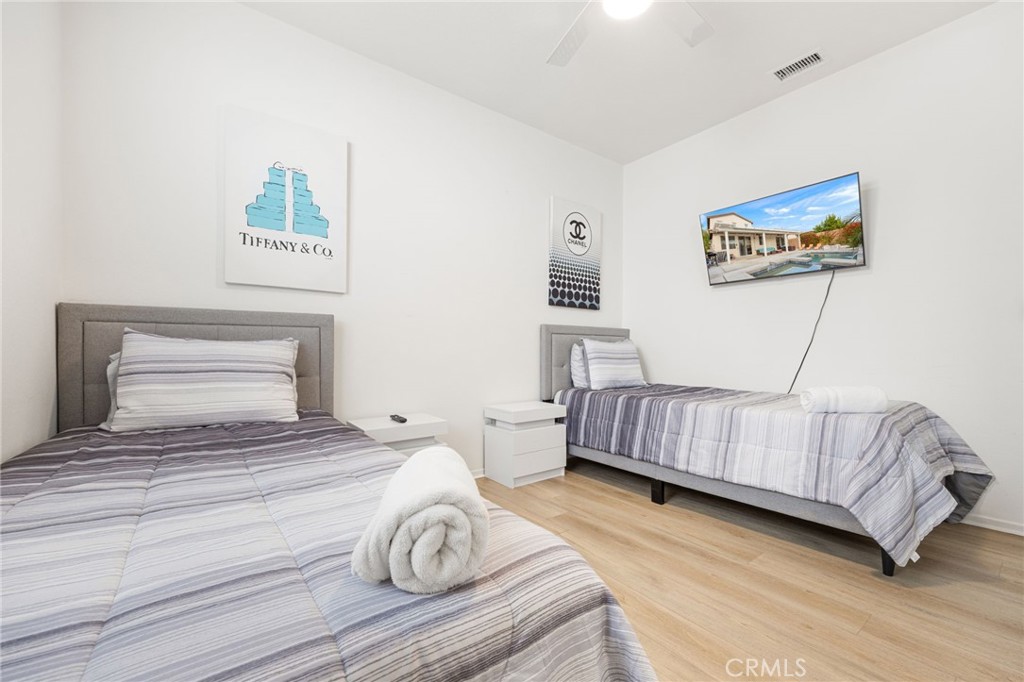 84155 Tramonto Way Indio, CA 92203 - Photo 26 of 38 a bedroom with a bed and a dresser