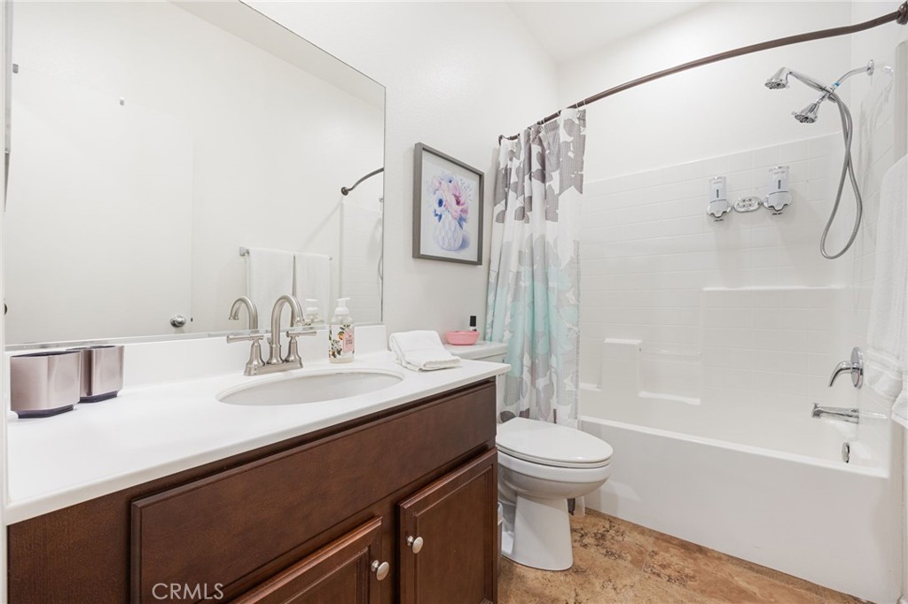 84155 Tramonto Way Indio, CA 92203 - Photo 29 of 38 a bathroom with a sink a toilet and a bathtub