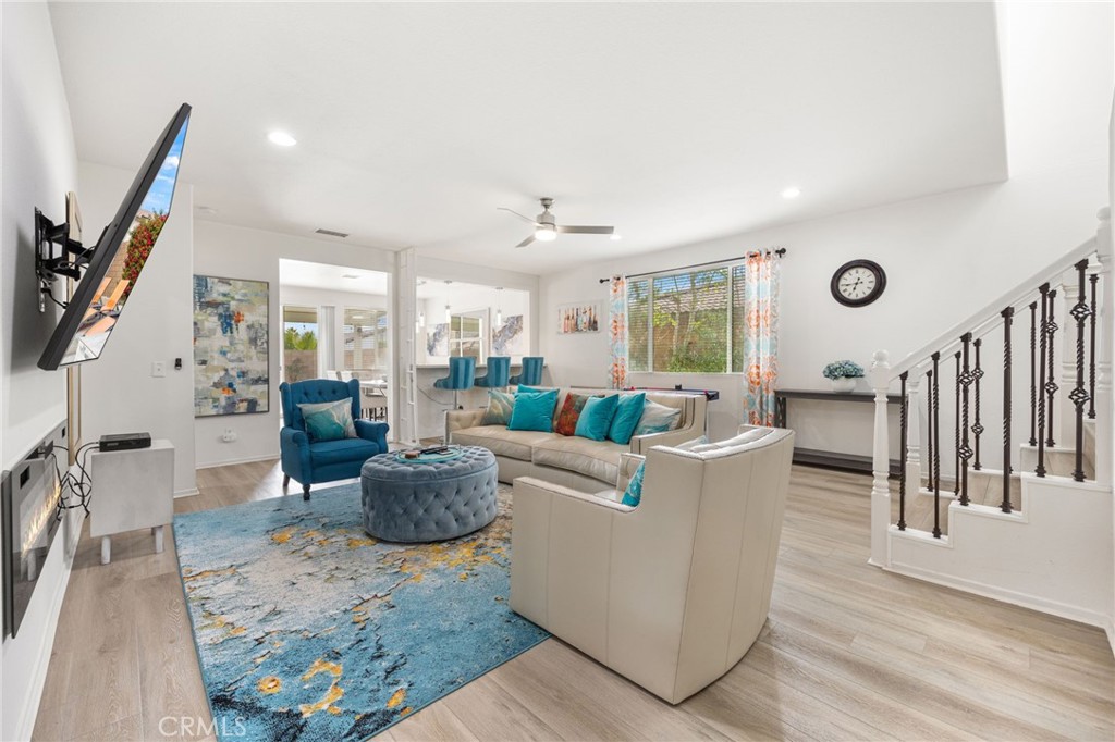 84155 Tramonto Way Indio, CA 92203 - Photo 7 of 38 a living room with furniture and wooden floor