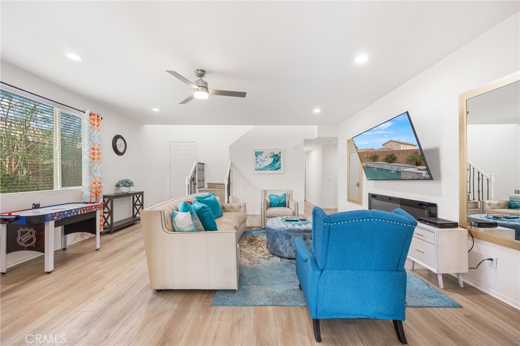 84155 Tramonto Way Indio, CA 92203 - Photo 9 of 38 a living room with furniture and wooden floor