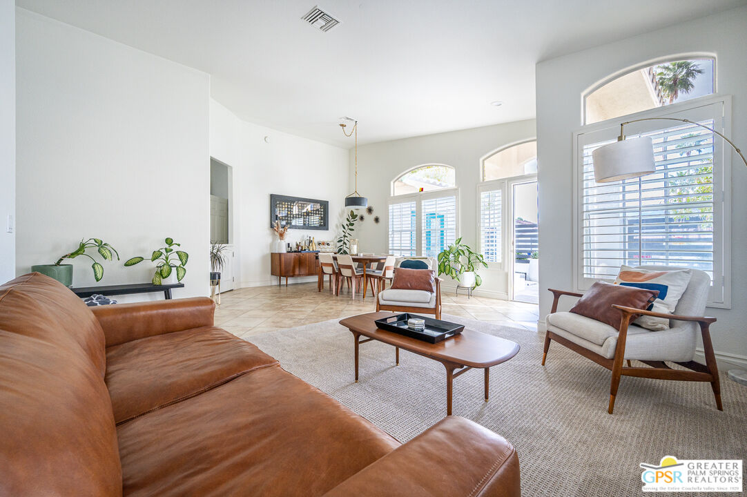 68210 Bella Vista Road Cathedral City, CA 92234 - Photo 1 of 47 a living room with furniture and a potted plant