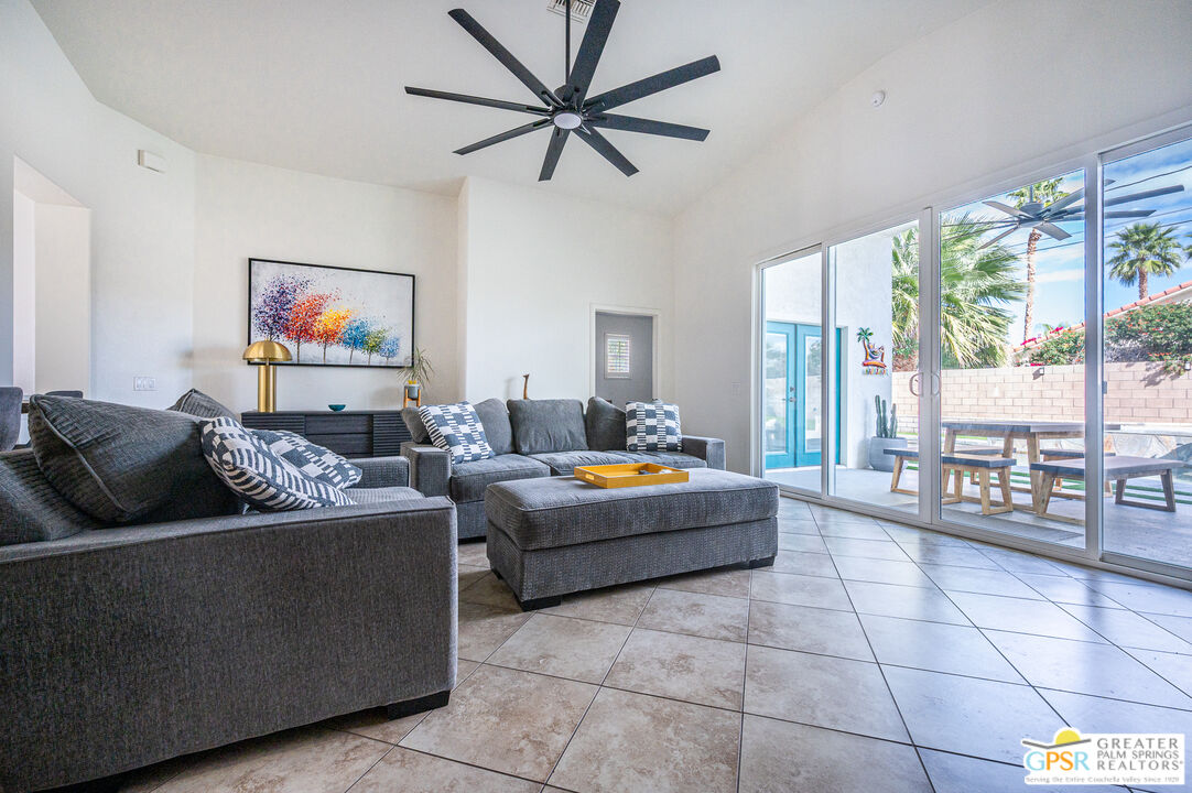68210 Bella Vista Road Cathedral City, CA 92234 - Photo 13 of 47 a living room with furniture and a large window