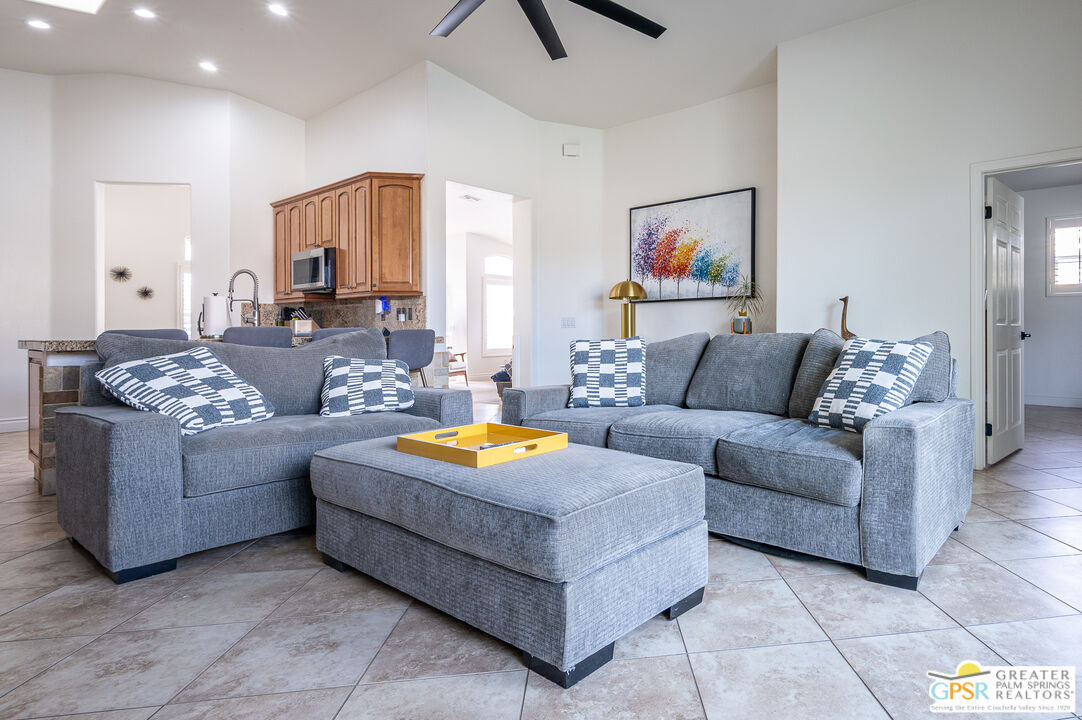 68210 Bella Vista Road Cathedral City, CA 92234 - Photo 14 of 47 a living room with furniture and a large window