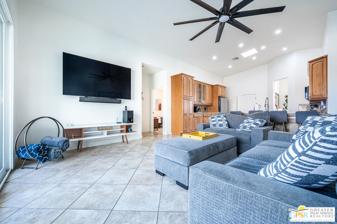68210 Bella Vista Road Cathedral City, CA 92234 - Photo 15 of 47 a living room with furniture and a flat screen tv