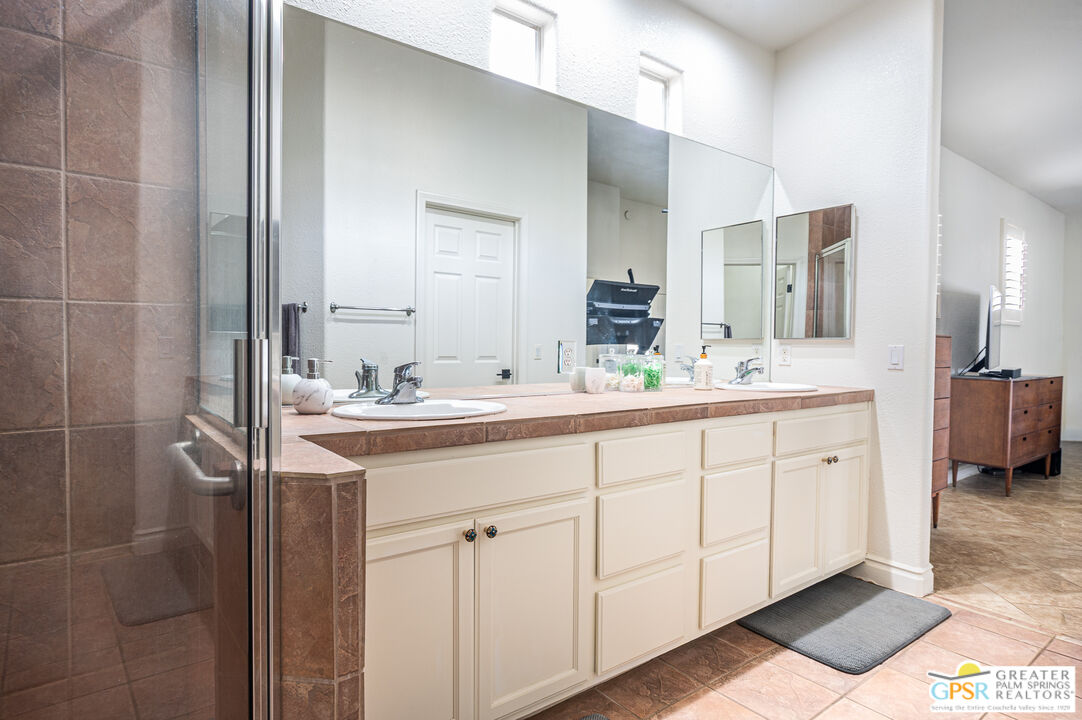 68210 Bella Vista Road Cathedral City, CA 92234 - Photo 24 of 47 a bathroom with a double vanity sink mirror and