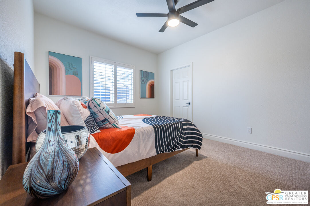 68210 Bella Vista Road Cathedral City, CA 92234 - Photo 27 of 47 a bedroom with furniture and a window