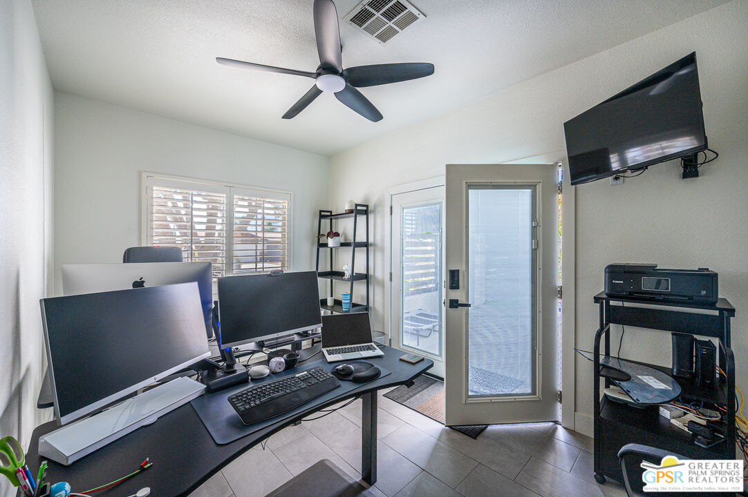 68210 Bella Vista Road Cathedral City, CA 92234 - Photo 31 of 47 a view of a workspace with furniture and a window