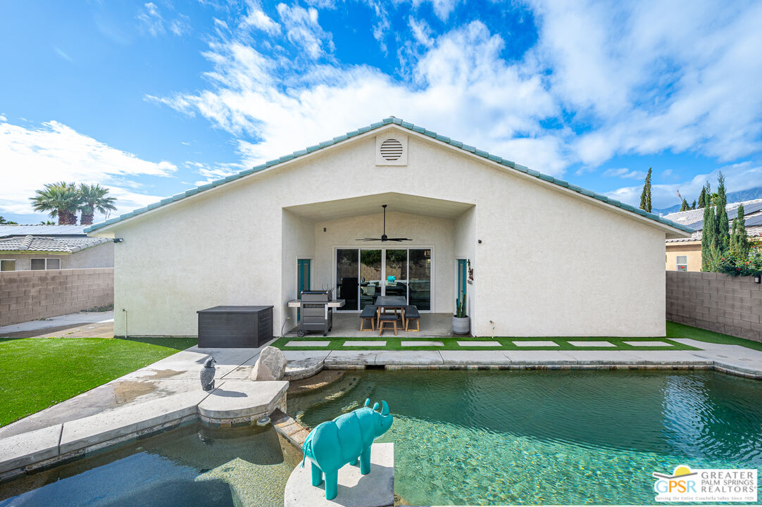 68210 Bella Vista Road Cathedral City, CA 92234 - Photo 32 of 47 a front view of a house with garden yard and outdoor seating