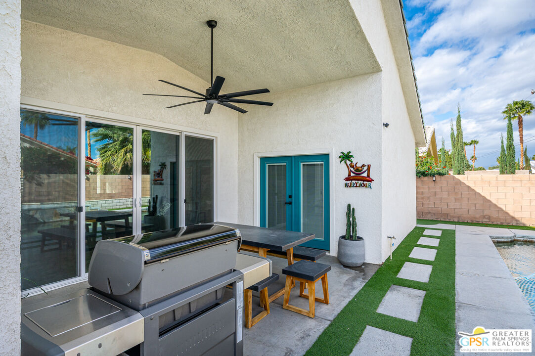68210 Bella Vista Road Cathedral City, CA 92234 - Photo 37 of 47 a living room with patio furniture and a window