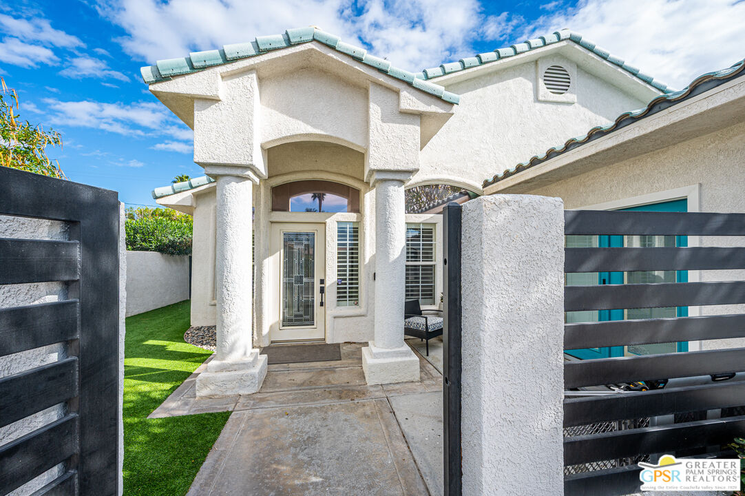 68210 Bella Vista Road Cathedral City, CA 92234 - Photo 41 of 47 a front view of a house with a yard