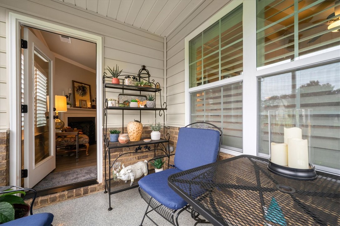 119 Shipyard Circle Anderson, SC 29621 - Photo 23 of 50 An delighful outdoor patio, perfect for leisurely mornings or relaxed evenings. Notice the epoxy flooring, which makes for easy maintenance and clean up from dirty golf shoes.