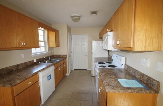 192 Mary Lane Crestview, FL 32536 - Photo 2 of 15 a kitchen with granite countertop a sink and a stove
