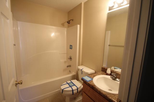 192 Mary Lane Crestview, FL 32536 - Photo 8 of 15 a bathroom with a granite countertop sink toilet and shower