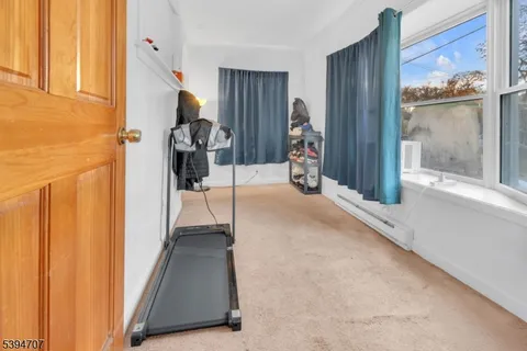 a view of a hallway with a living room