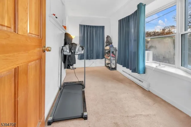 a view of a hallway with a living room