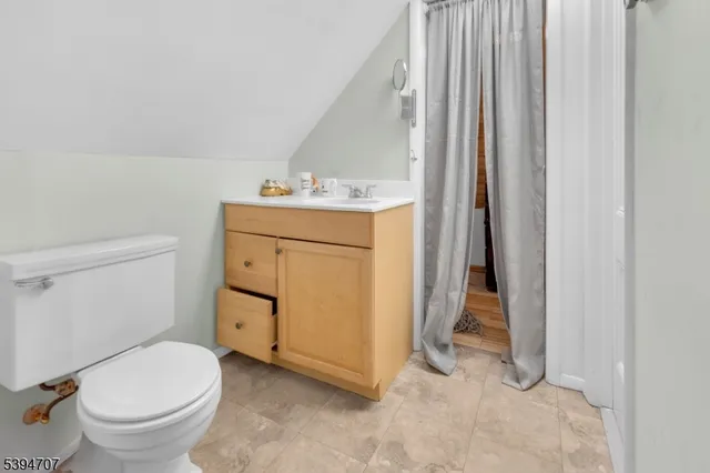 a bathroom with a sink toilet and vanity