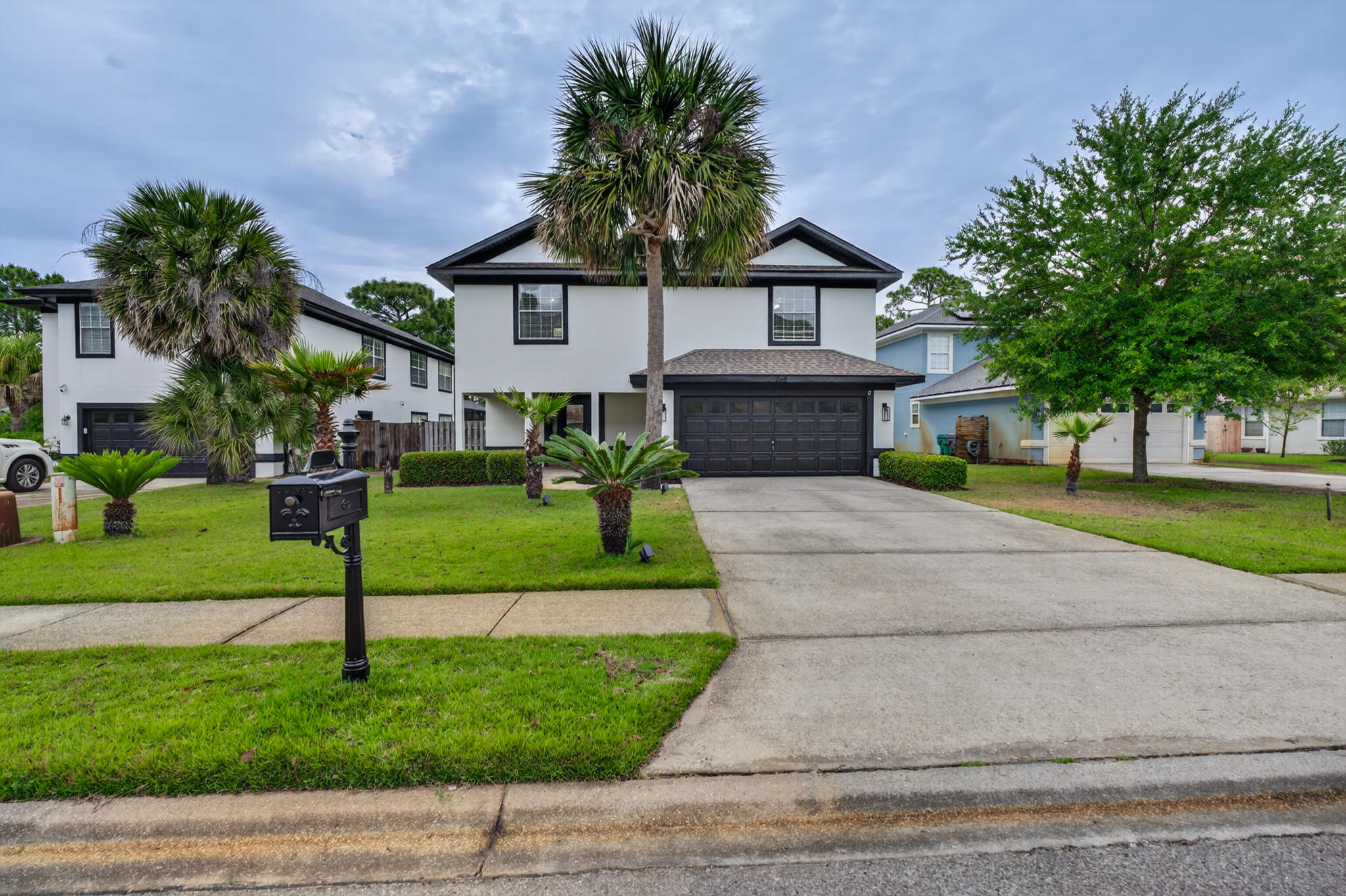 268 Loblolly Bay Drive Santa Rosa Beach, FL 32459 - Photo 60 of 73 a house with garden in front of it